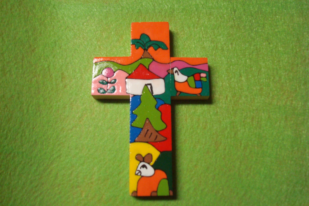 Värikäs risti vihreällä pohjalla