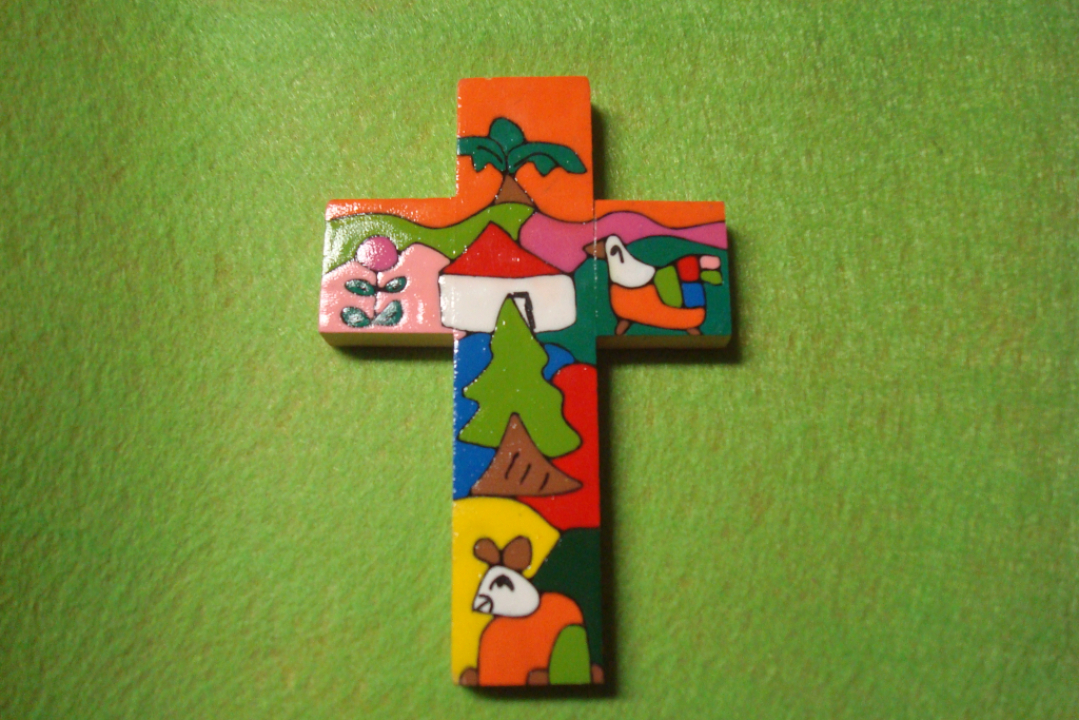 Värikäs risti vihreällä pohjalla